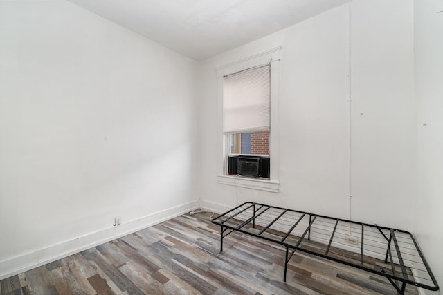 910 Hamlet St, Newport, KY 41071 - spare room featuring baseboards, wood finished floors, and cooling unit