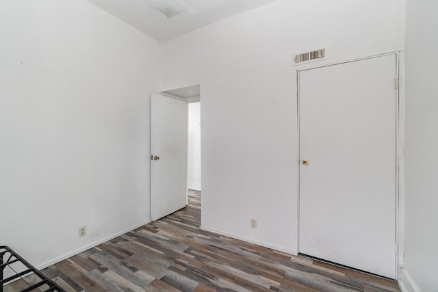 910 Hamlet St, Newport, KY 41071 - unfurnished bedroom featuring baseboards, visible vents, and wood finished floors