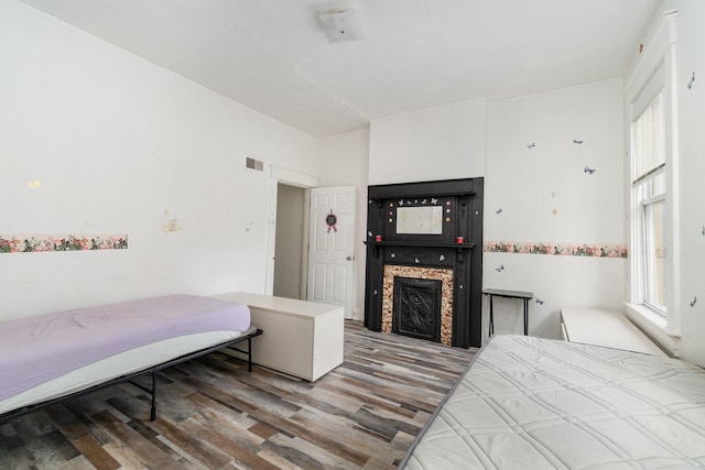 910 Hamlet St, Newport, KY 41071 - bedroom featuring multiple windows, a fireplace, wood finished floors, and visible vents
