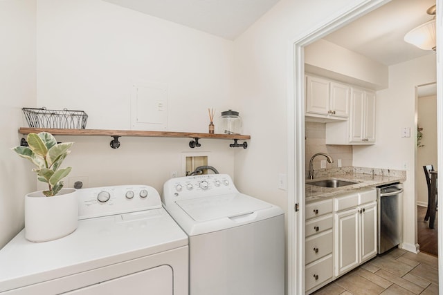 2810 Dry Ridge Ct, Villa Hills, KY 41017 - laundry room with independent washer and dryer, a sink, and light wood finished floors