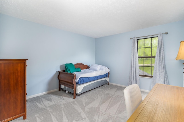 bedroom featuring carpet floors and baseboards