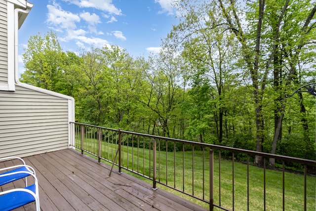 wooden terrace with a lawn
