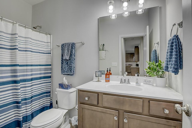 bathroom featuring vanity, a shower with shower curtain, and toilet