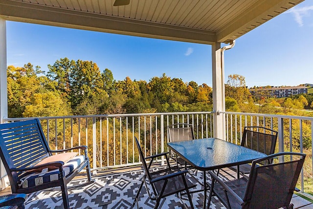 balcony with a ceiling fan and outdoor dining area