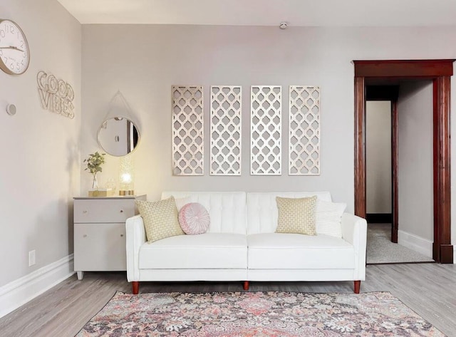 living room featuring baseboards and wood finished floors