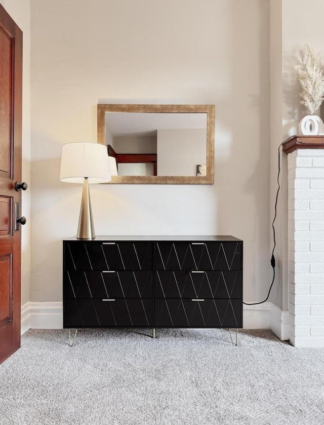 interior details featuring carpet floors and baseboards