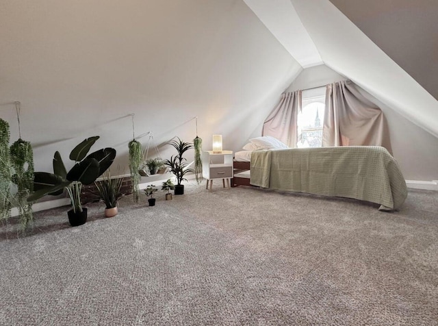 carpeted bedroom featuring vaulted ceiling