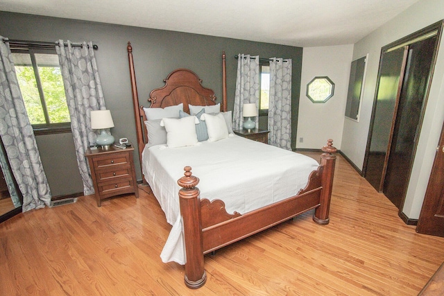 bedroom with wood finished floors