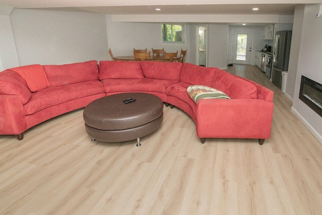 living room featuring recessed lighting and wood finished floors