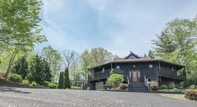 view of front of property with stairway