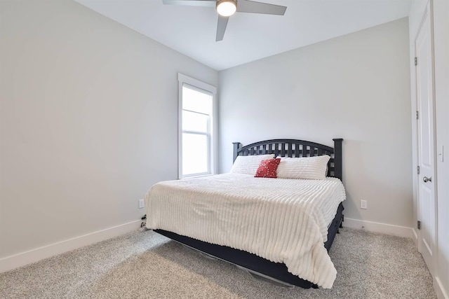 bedroom with carpet flooring, baseboards, and ceiling fan