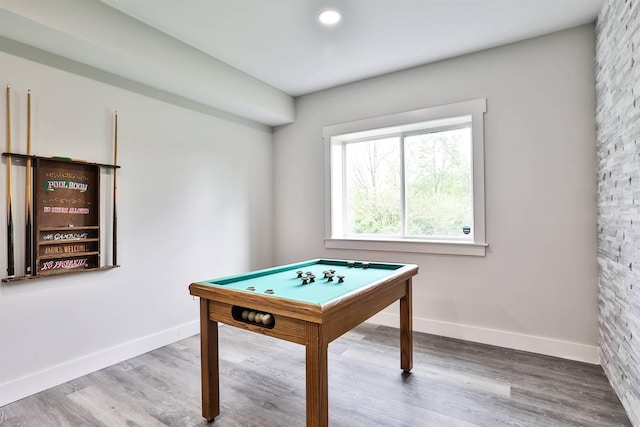 rec room featuring baseboards and wood finished floors