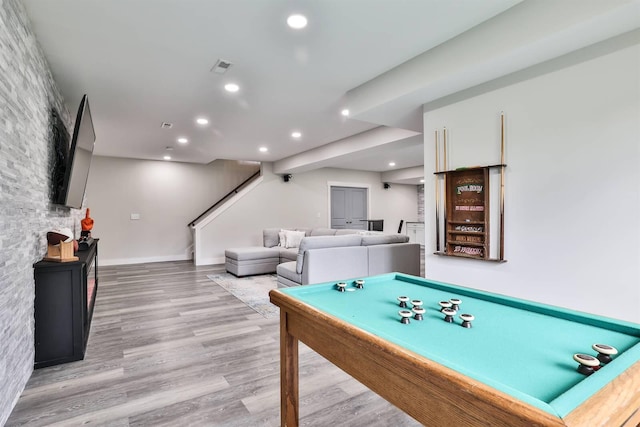 recreation room featuring recessed lighting, baseboards, wood finished floors, and visible vents