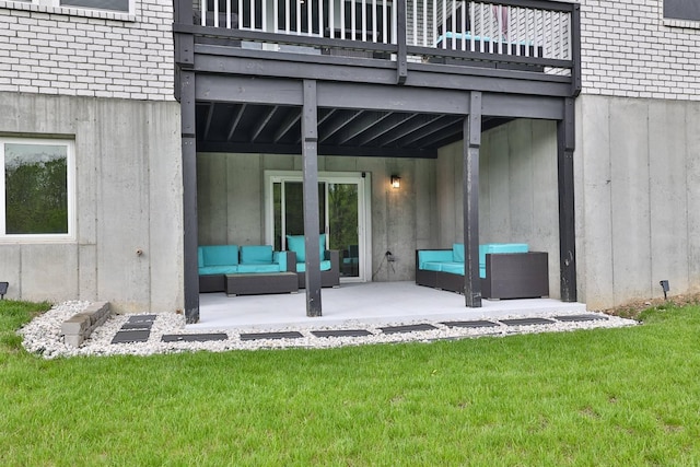 exterior space featuring a lawn, outdoor lounge area, a patio area, and brick siding