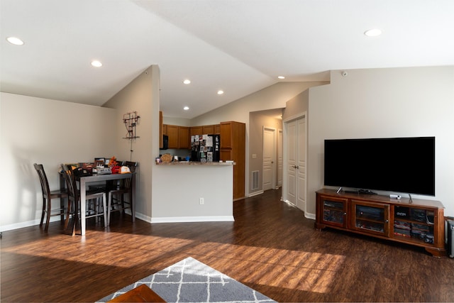living room with dark wood-type flooring, baseboards, visible vents, lofted ceiling, and recessed lighting