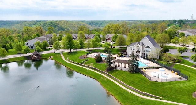aerial view featuring a water view and a forest view