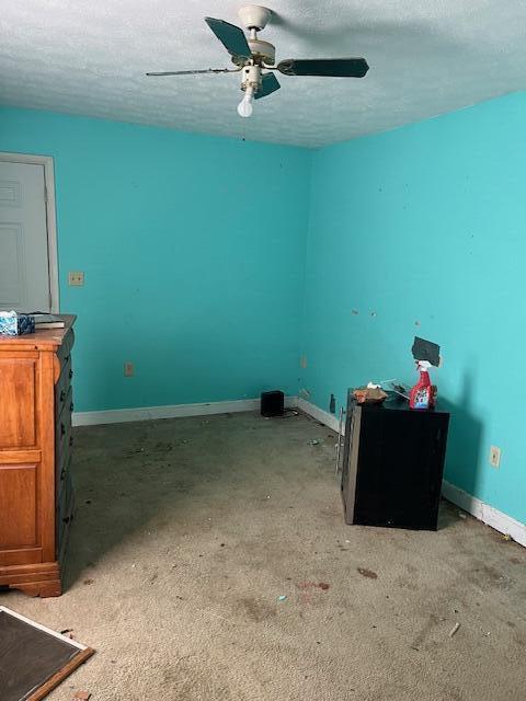 407 E E Shelby St, Falmouth, KY 41040 - interior space with baseboards, ceiling fan, and a textured ceiling