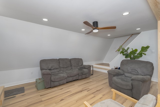 living area with wood finished floors, recessed lighting, a ceiling fan, and baseboards