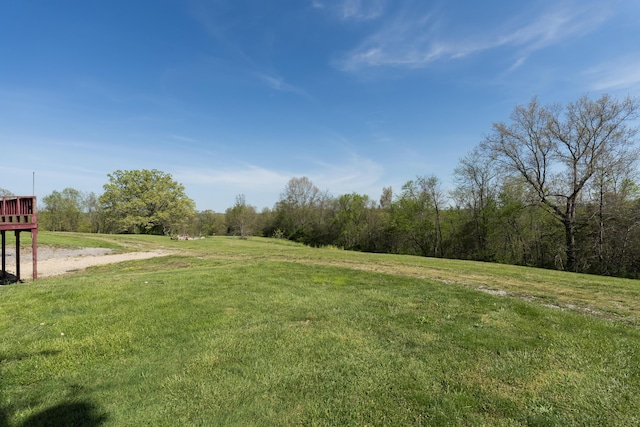 view of green lawn featuring a view of rural / pastoral area
