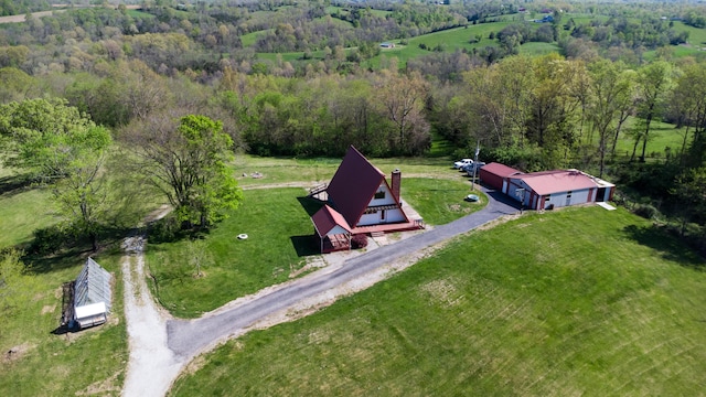 view from above of property featuring a heavily wooded area