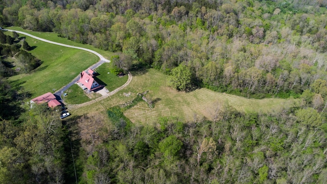 aerial view of property's location with a forest