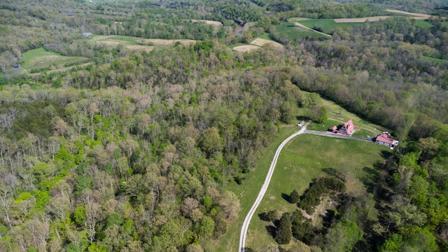 aerial overview of property's location featuring a heavily wooded area