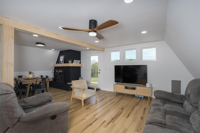 living room featuring light wood-style floors, recessed lighting, ceiling fan, a brick fireplace, and beam ceiling