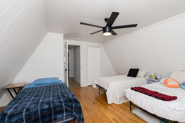 bedroom featuring light wood-style flooring and ceiling fan