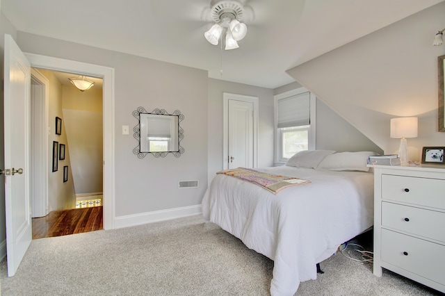 bedroom with carpet floors, a ceiling fan, baseboards, and visible vents