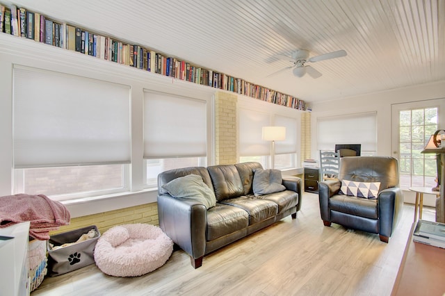 living room with ceiling fan and wood finished floors