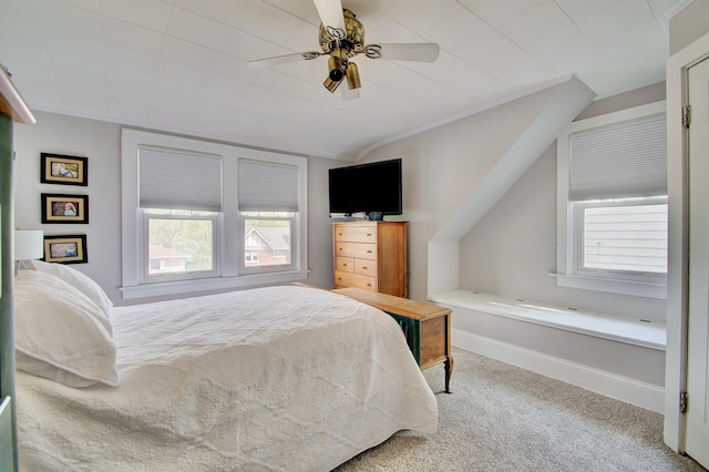 carpeted bedroom featuring multiple windows, ornamental molding, ceiling fan, and lofted ceiling