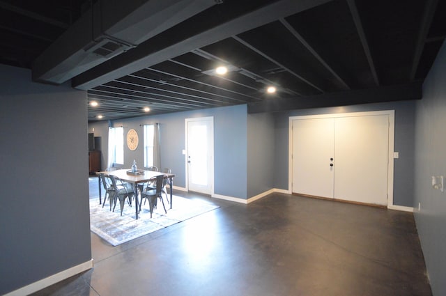 below grade area featuring baseboards and visible vents
