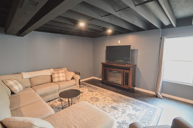 living room with baseboards and finished concrete floors