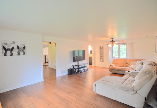 1376 Symbo Ln, Walton, KY 41094 - living area with light wood-type flooring, a ceiling fan, baseboards, and visible vents