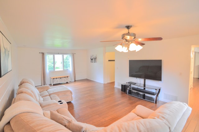 1376 Symbo Ln, Walton, KY 41094 - living area with a ceiling fan, radiator heating unit, visible vents, and wood finished floors