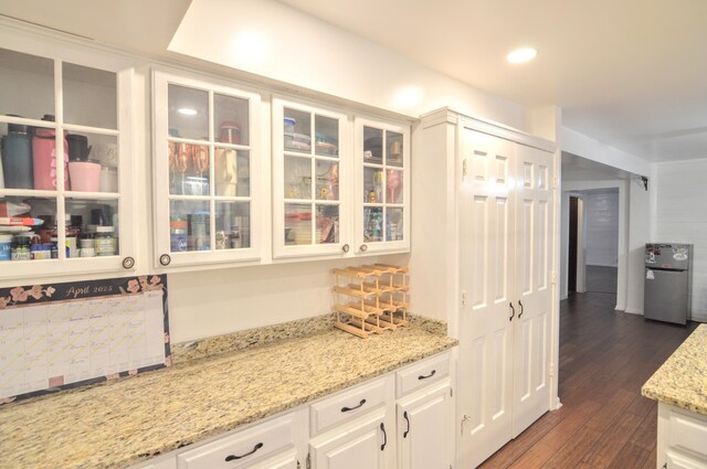 1376 Symbo Ln, Walton, KY 41094 - kitchen with dark wood-style flooring, white cabinets, light stone countertops, and glass insert cabinets
