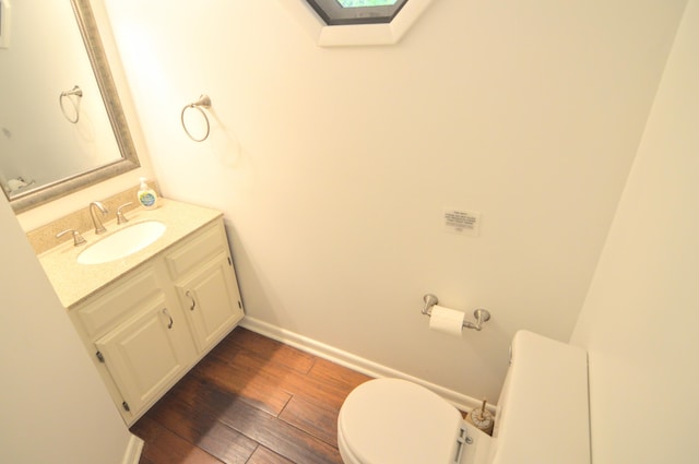 1376 Symbo Ln, Walton, KY 41094 - half bath with vanity, baseboards, wood finished floors, and toilet