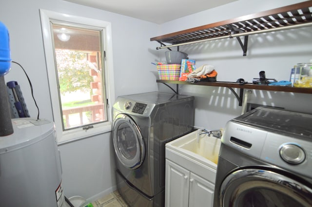 1376 Symbo Ln, Walton, KY 41094 - laundry room featuring water heater, baseboards, cabinet space, and independent washer and dryer