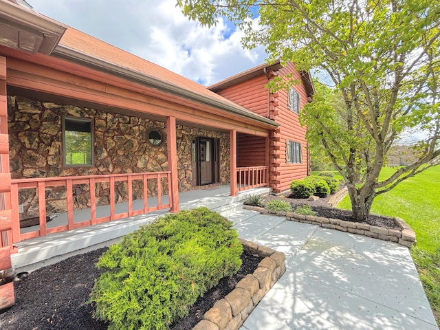 1376 Symbo Ln, Walton, KY 41094 - doorway to property featuring log siding and a porch