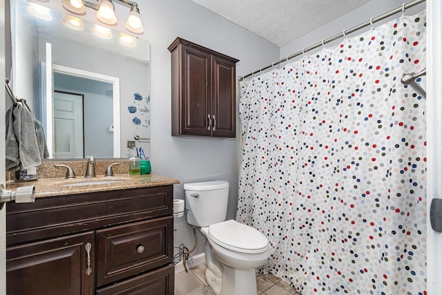 bathroom featuring tile patterned flooring, vanity, toilet, baseboards, and a shower with curtain