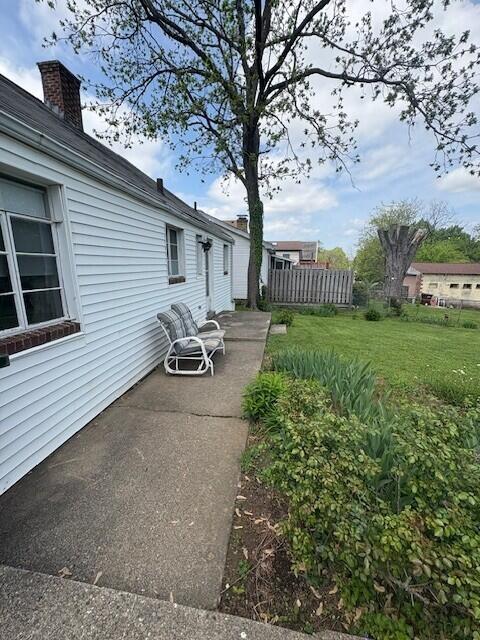 exterior space featuring a patio area and fence