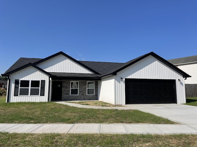 100 Mourning Dove Dr, Warsaw, KY 41095 - modern inspired farmhouse with a garage, a front lawn, roof with shingles, and driveway