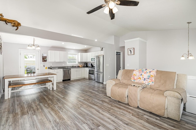 465 Eagle Creek Dr, Dry Ridge, KY 41035 - living area featuring wood finished floors, recessed lighting, ceiling fan with notable chandelier, and lofted ceiling
