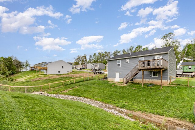 465 Eagle Creek Dr, Dry Ridge, KY 41035 - rear view of property with a lawn, a fenced backyard, a wooden deck, and stairway