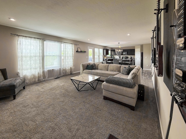 living room with carpet flooring, baseboards, and recessed lighting