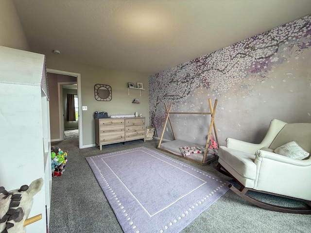 sitting room featuring dark colored carpet