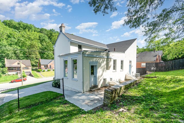 816 Highland Ave, Fort Wright, KY 41011 - rear view of property with brick siding and a chimney