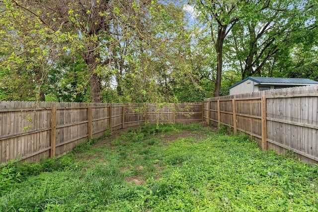 view of yard with a fenced backyard