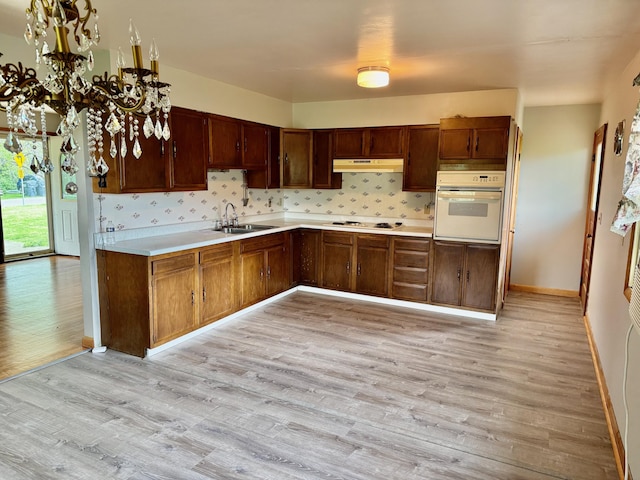 3390 Rector Rd, Morning View, KY 41063 - kitchen featuring a sink, light countertops, baseboards, light wood finished floors, and white appliances