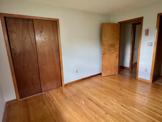 3390 Rector Rd, Morning View, KY 41063 - unfurnished bedroom with baseboards, a closet, and light wood finished floors